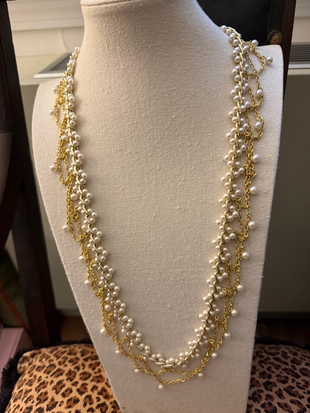 Multi Strand Faux Pearl Adjustable Long Necklace Featuring Gold Tone Chains.